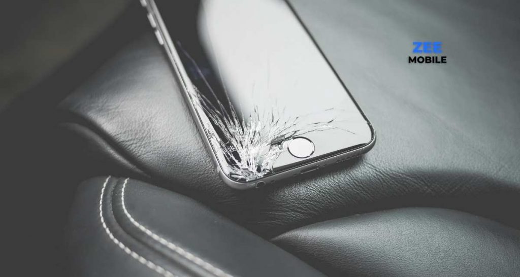 Metallic cracked screen iPhone 7. on a luxury car seat on its way to Zee Mobile Cell phone repair shop.